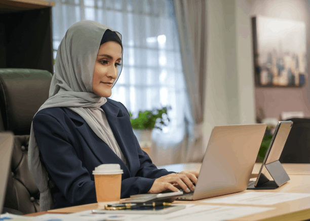 A Houston linguist reviews Arabic and English copy side by side, showing Arabic Translation Services in Houston for accurate.