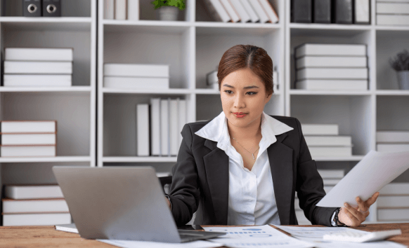 Translator providing Certified translation services in Houston while client reviews legally valid documents.