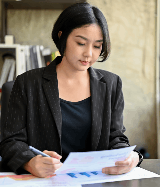 A translator in a Houston office signs and seals a certified packet for Vietnamese Translation Services in Houston.