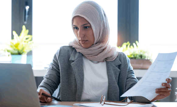 A translator delivers a same-day document, showing Arabic Translation Services in Houston with fast turnaround for business.