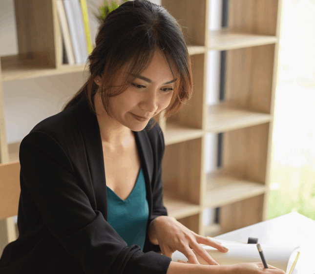 The translator reviews a Chinese document in a Houston office, highlighting Chinese Translation Services in Houston.