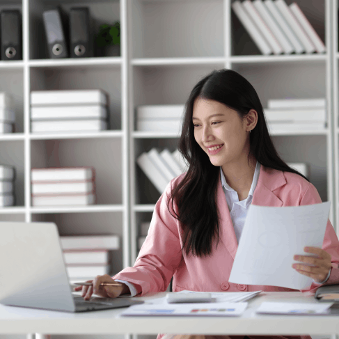 A translator checks an apostille packet and certified copy while providing Spanish Translation Services in Houston.