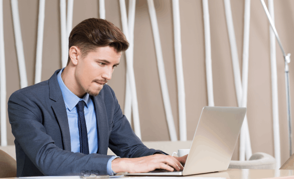 A translator types at a desk, delivering Spanish Translation Services in Houston for all needs with fast and accurate.