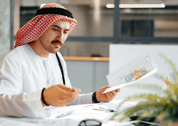 A translator compares Arabic and English legal terms on a checklist, demonstrating Arabic Translation Services in Houston.