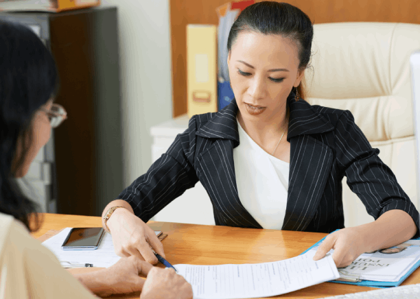 A translator checks a bilingual contract at a Houston law office, providing Vietnamese Translation Services in Houston.