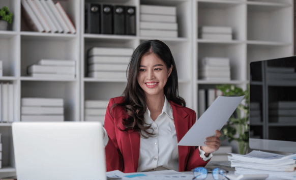 Translator reviewing Marriage Certificate Translation Services in Houston document with USCIS certification seal.