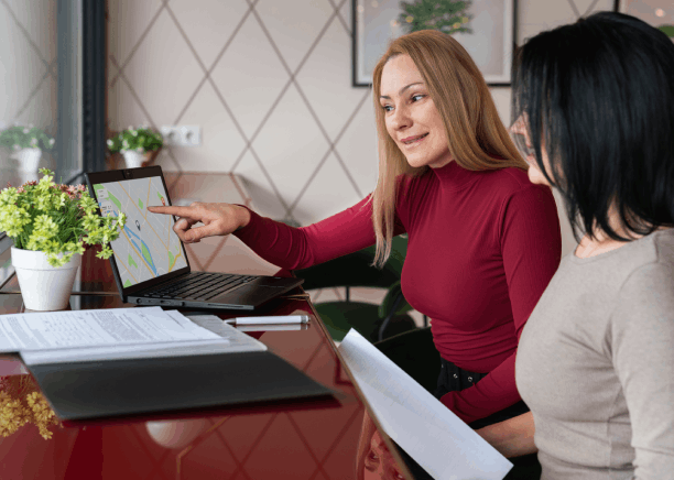 A translator scans mixed document types for a neighborhood client, showing Spanish Translation Services in Houston community.