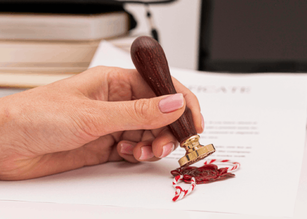 A paralegal stamps apostille paperwork beside court filings, using Spanish Translation Services in Houston for legal.