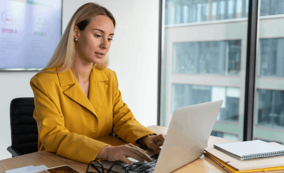 A business owner receives a fast translated file on a laptop, relying on Vietnamese Translation Services in Houston.